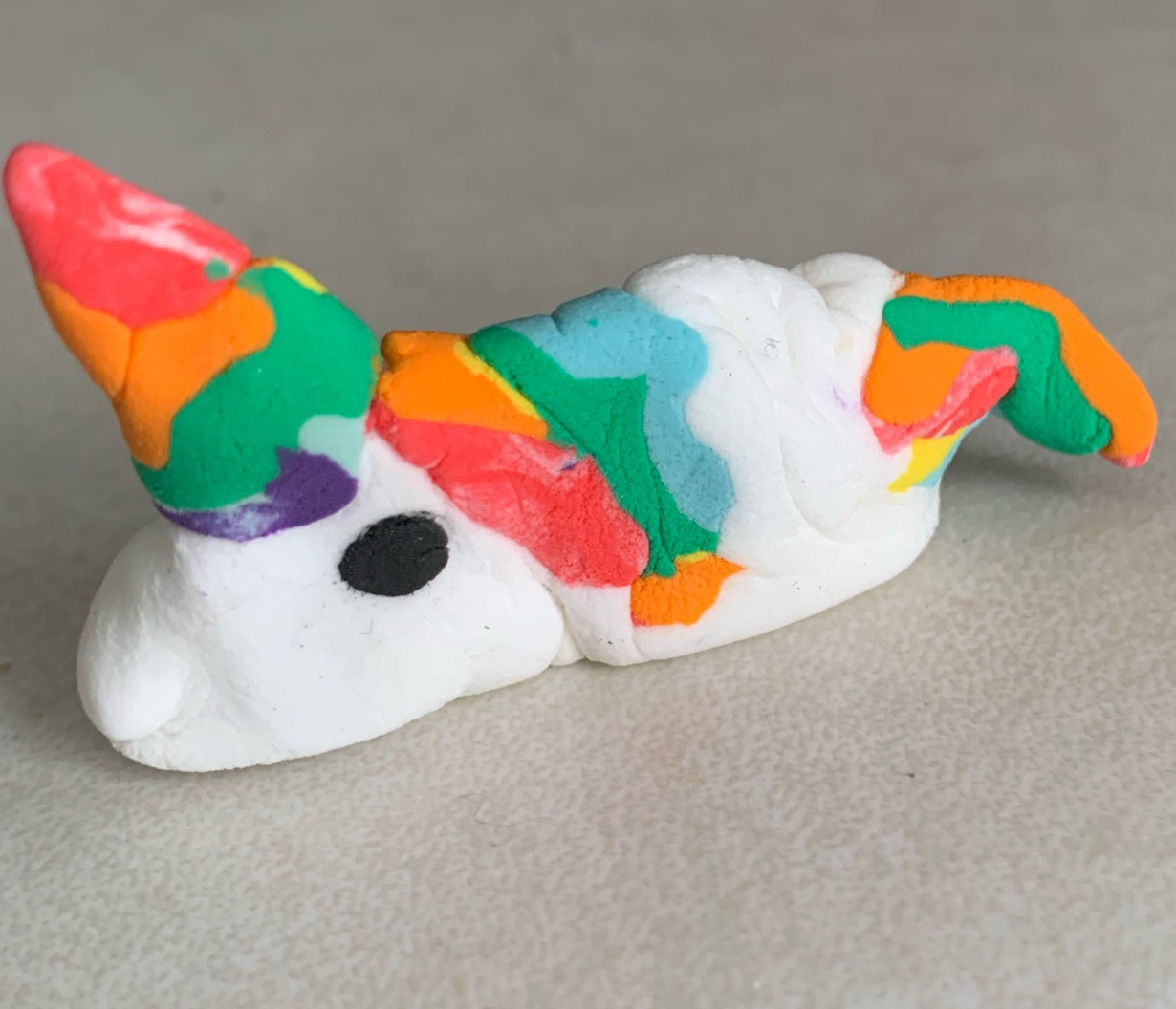 Resting baby clay unicorn